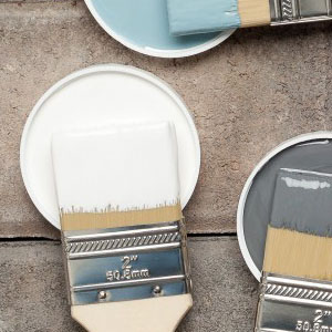 paint brushes with white, grey & blue paint colours